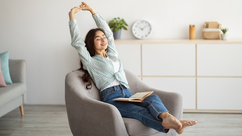 woman stretching on chair