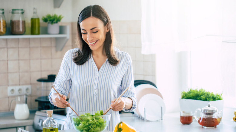 A woman cooking a healthy meal 