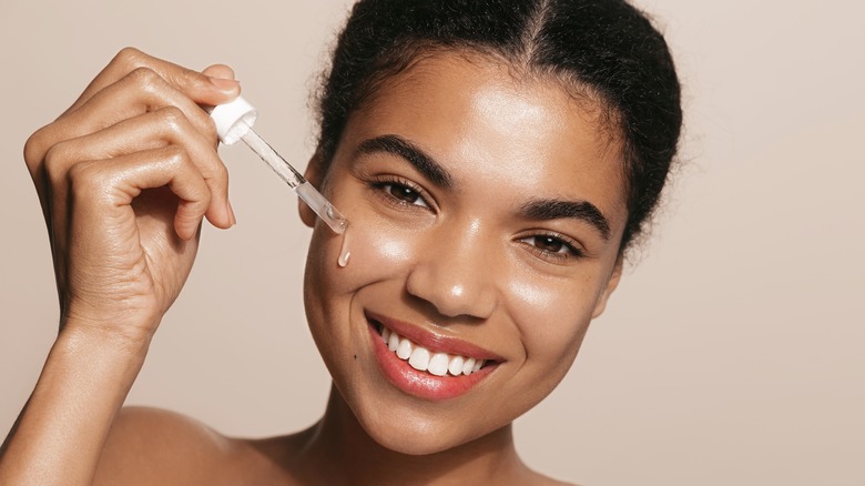 A woman taking a collagen suppliment 