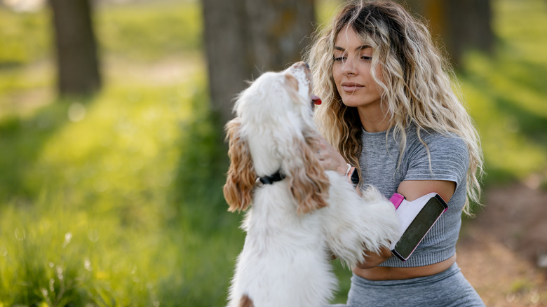 Woman hugging her dog 