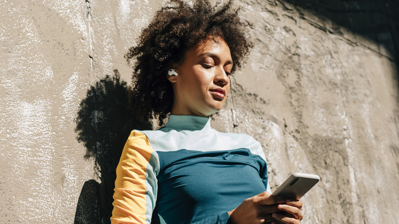 woman looking at phone