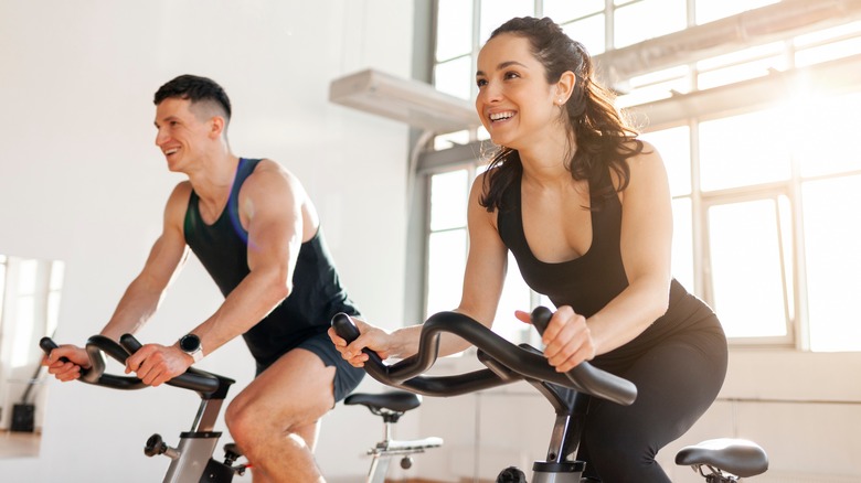 couple on stationary bikes