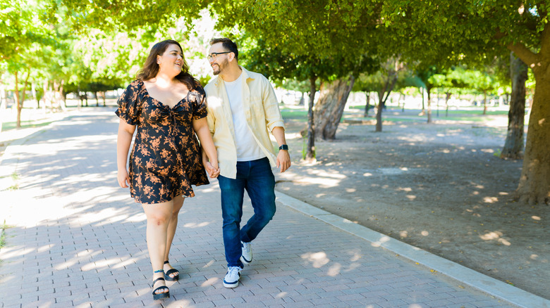 couple walking in park