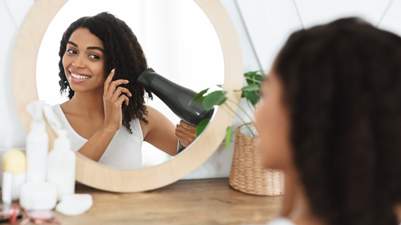 woman doing an at-home blowout