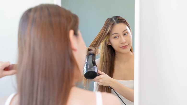 woman doing an at-home blowout