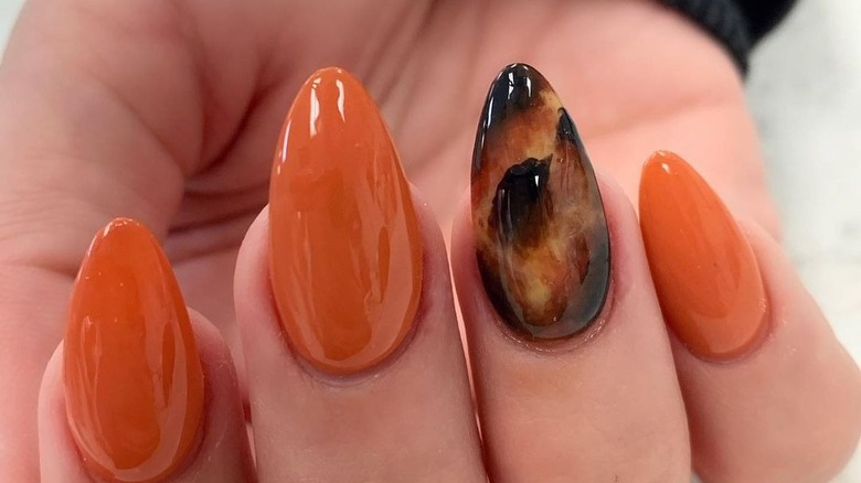 Woman wearing a feature nail