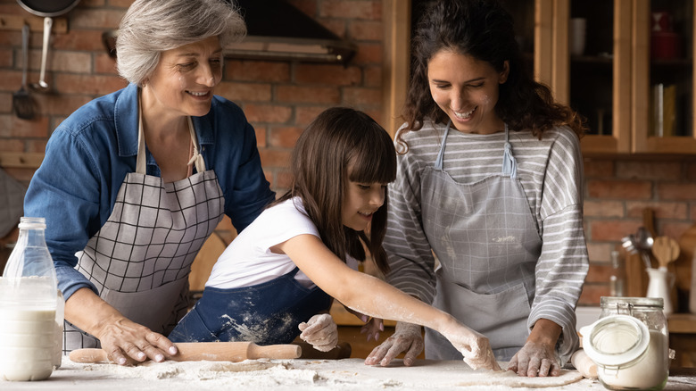 Grandma, mom, and daughter in kitchen