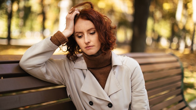 young woman on park bench