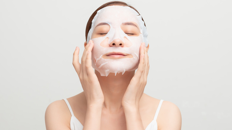 woman wearing sheet mask