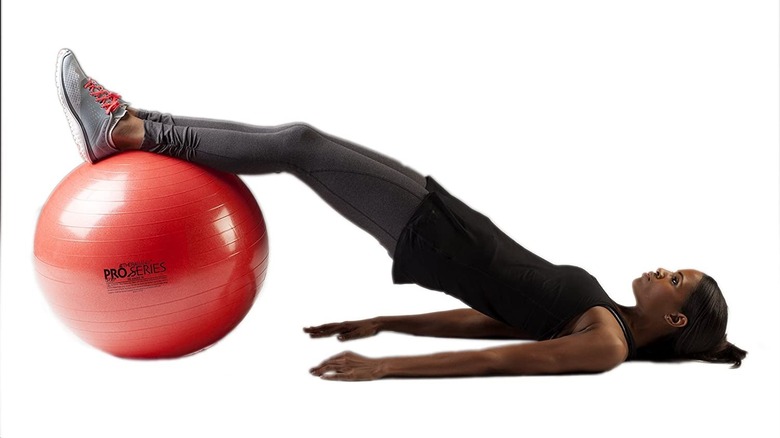 Woman exercising with stability ball