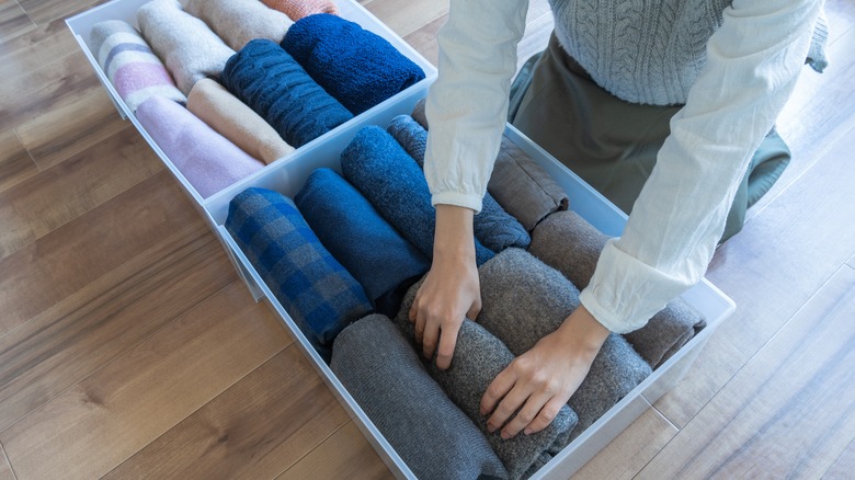 Woman organizing storage bins