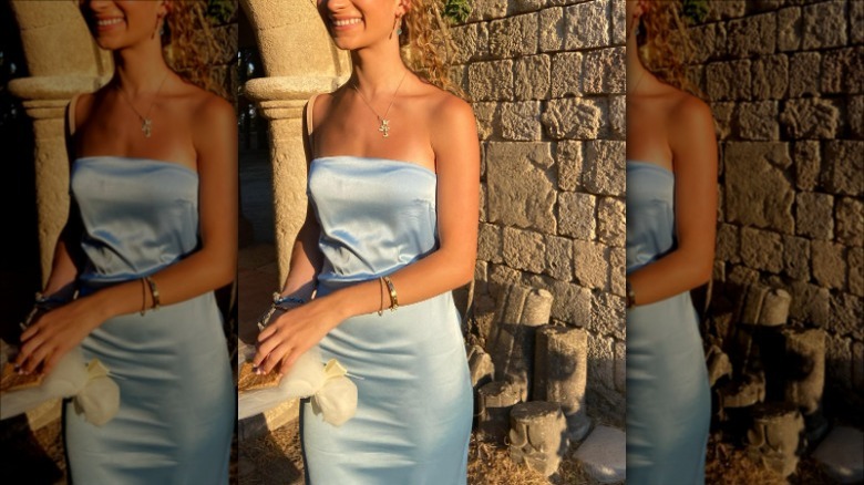 woman wearing blue satin tube dress