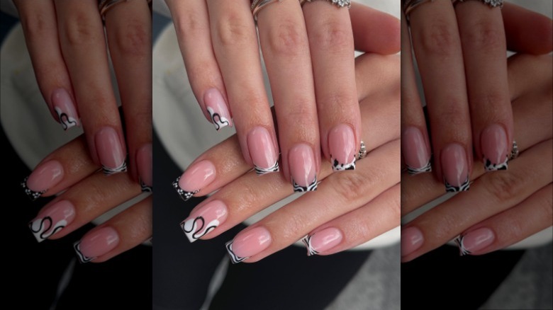 manicure of white and black mismatched nails