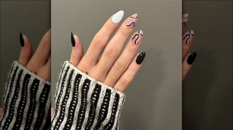 black and white manicure with two statement nails