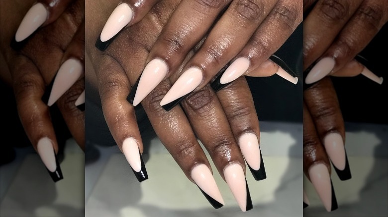 close up of white nails with black lines