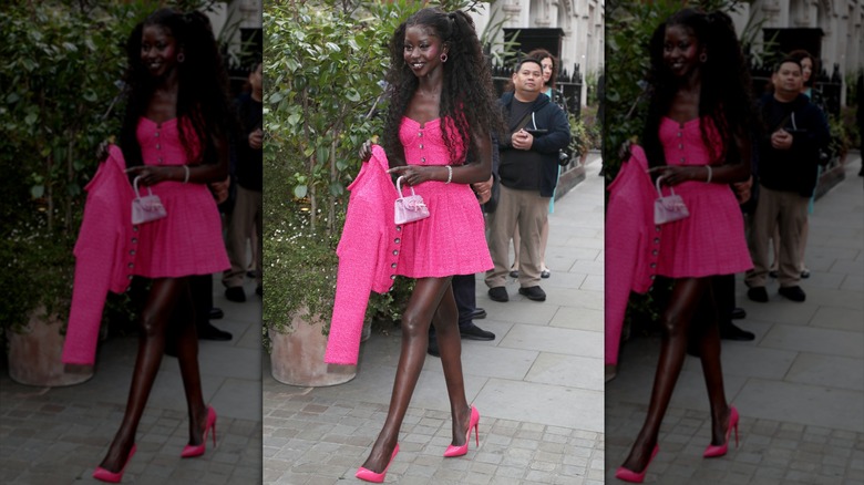 Aweng Chuol wearing pink tweed minidress