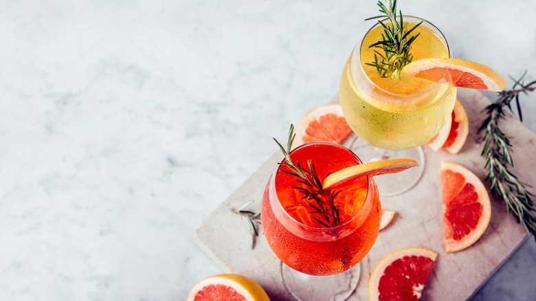 Photo of aperol spritzes with orange slices