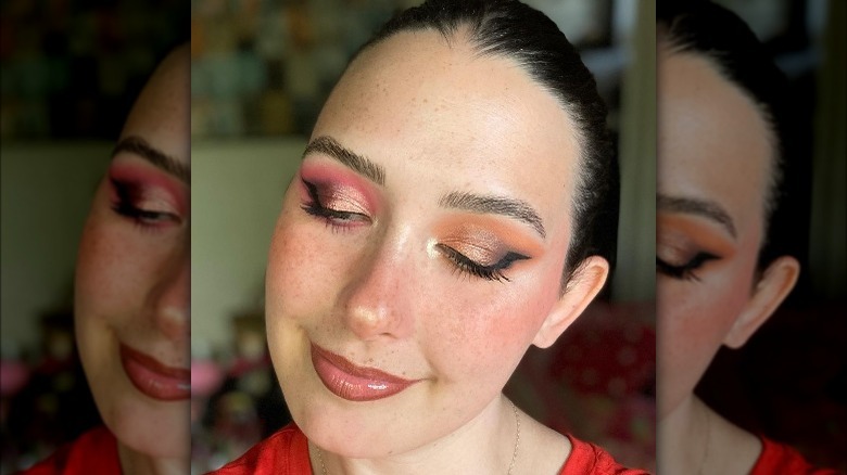 woman wearing red-orange eyeshadow