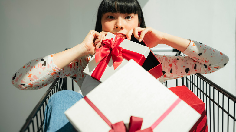 woman holding gift boxes