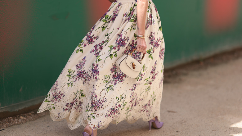woman wearing floral maxi skirt