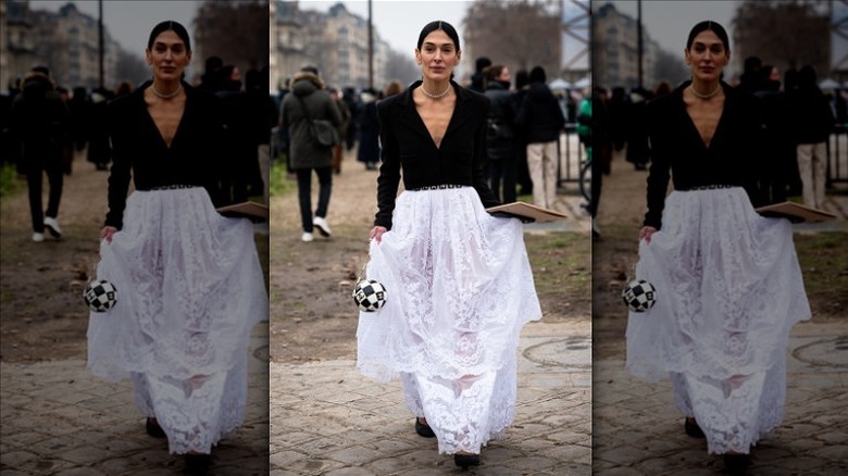 woman wearing lace maxi skirt