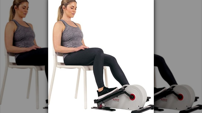 woman using under desk elliptical