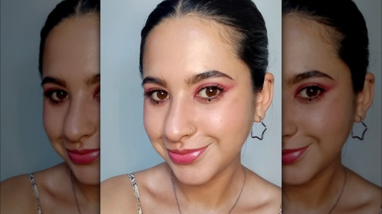 woman with brown underliner and dot