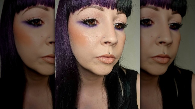 woman with purple underliner