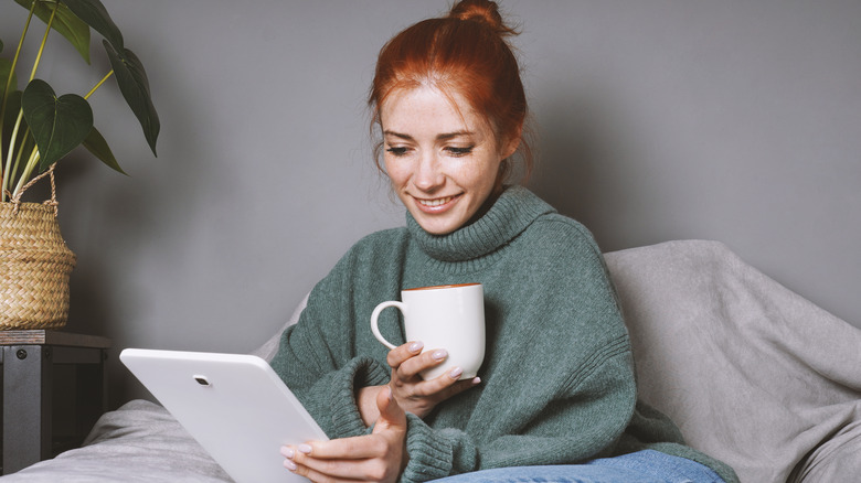 Woman reading a Kindle in bed