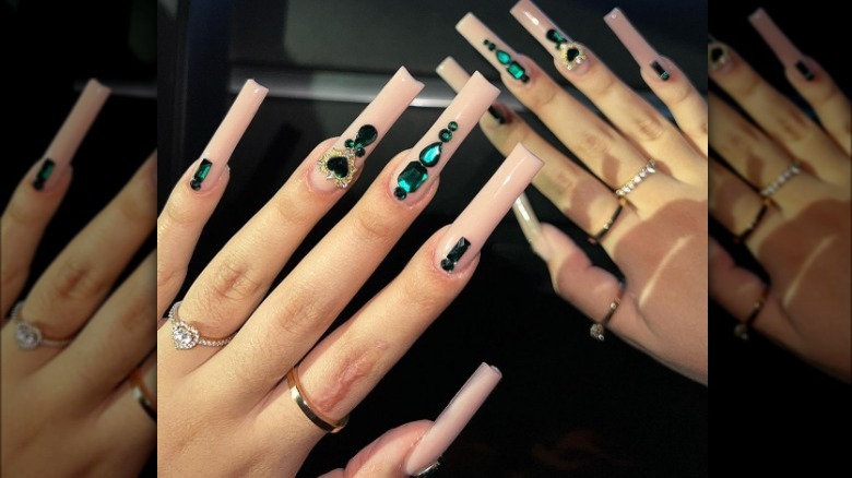 emerald green gems on manicure 