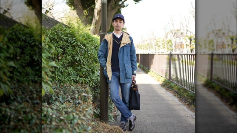 Man in jeans and blue jacket