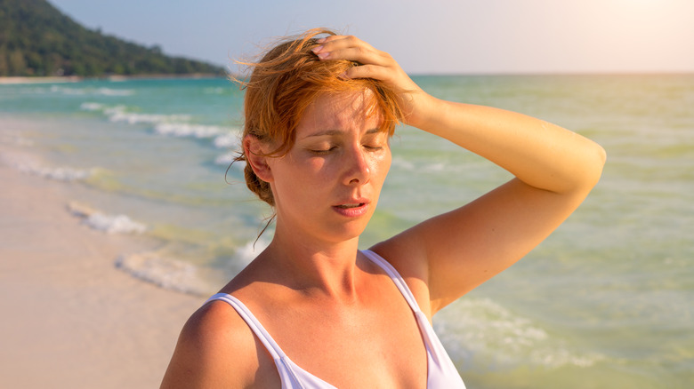 Woman sweating on beach