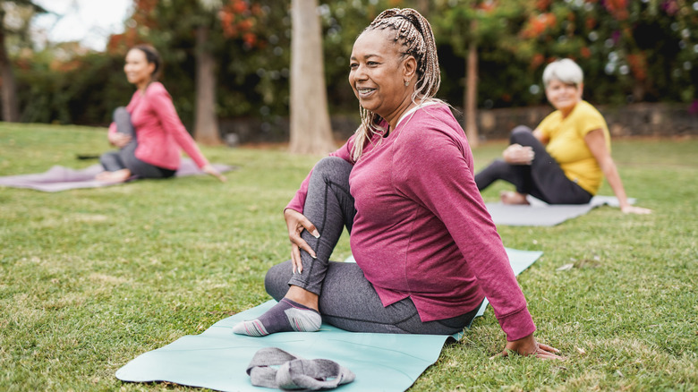 Women doing yoga outside