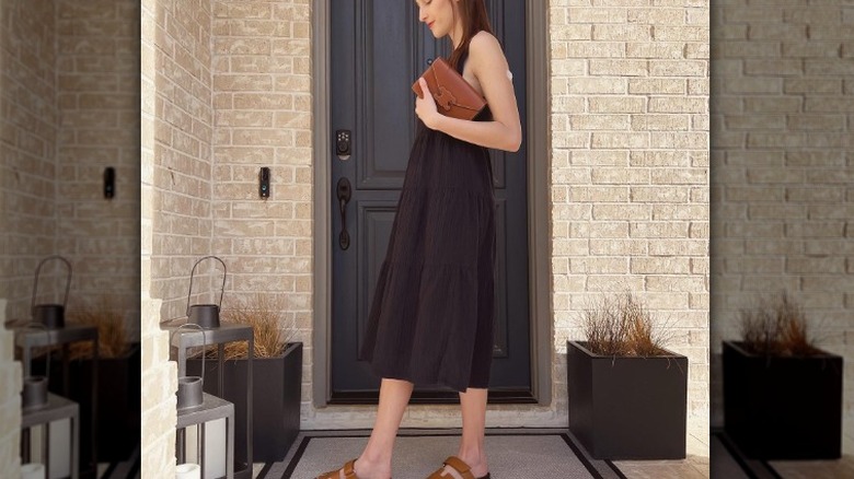 Woman in LBD, brown accessories