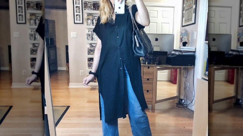 Woman wearing LBD over jeans