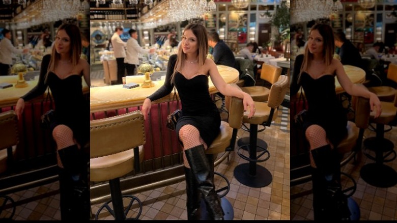 Woman in LBD, tall boots