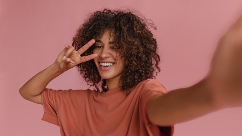 young woman taking selfie