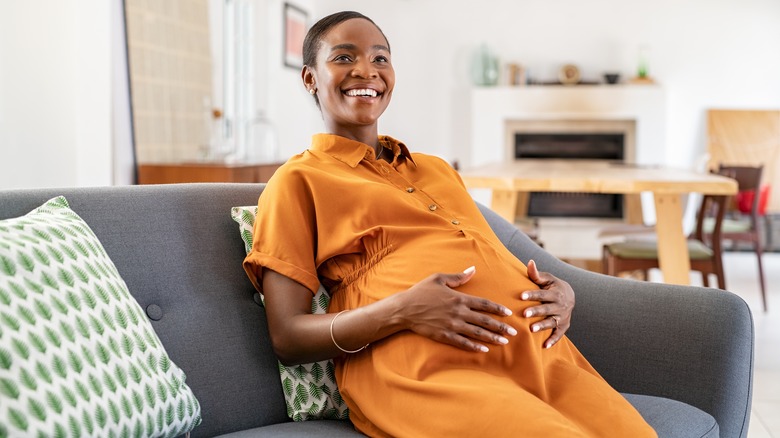 Pregnant woman orange dress
