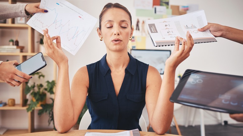 Woman practicing yoga at work