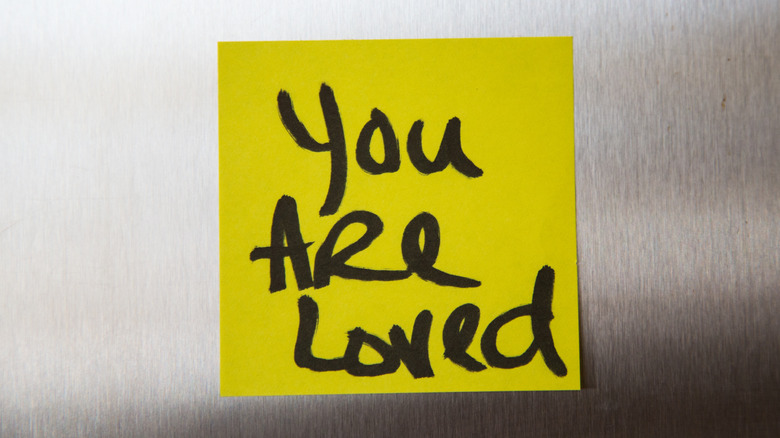 Post-it note stating "you are loved"