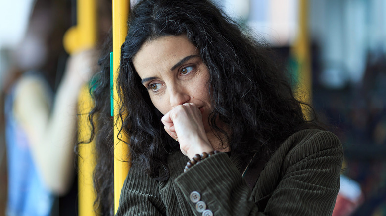 Worried woman on bus