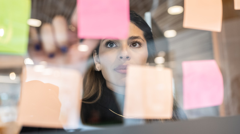 Woman organizing sticky notes