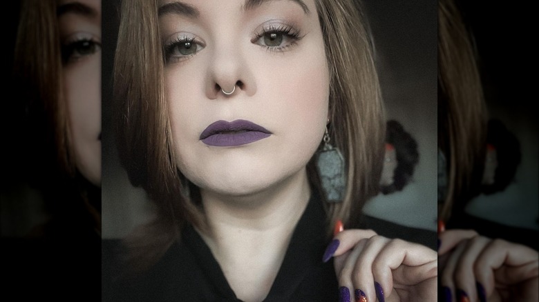 woman wearing purple lip color