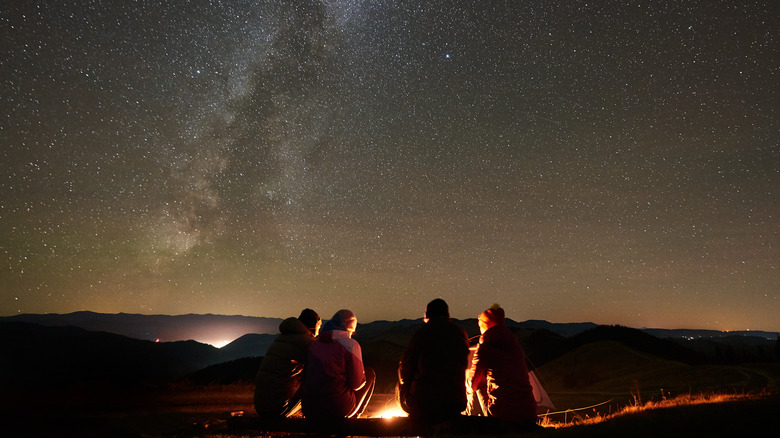 Friends under night sky