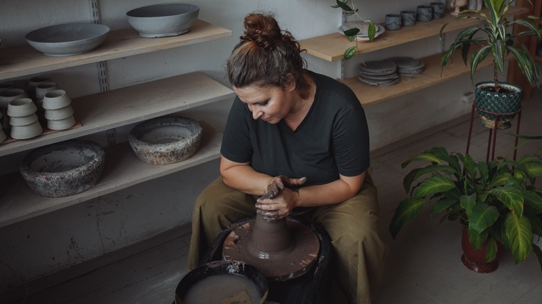 Woman making pottery