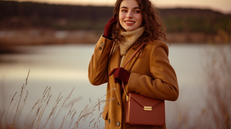 girl holding leather purse