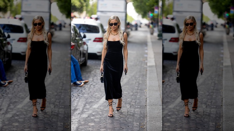 woman wearing long velvet slip dress