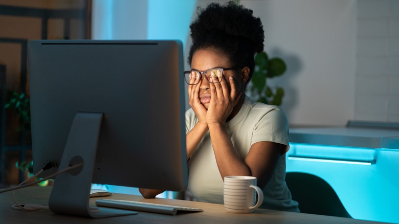 Stressed woman at computer