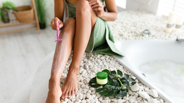 woman shaving legs