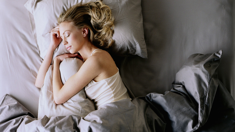 Woman asleep in bed